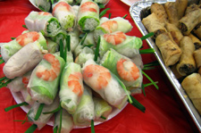 Image of Spring rolls with green oinins and egg rolls
